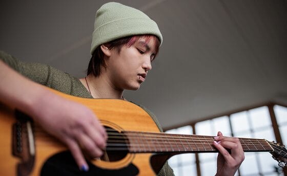 boy playing guitar