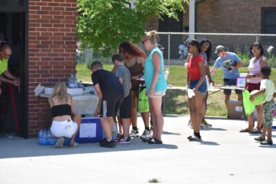 people waiting for water